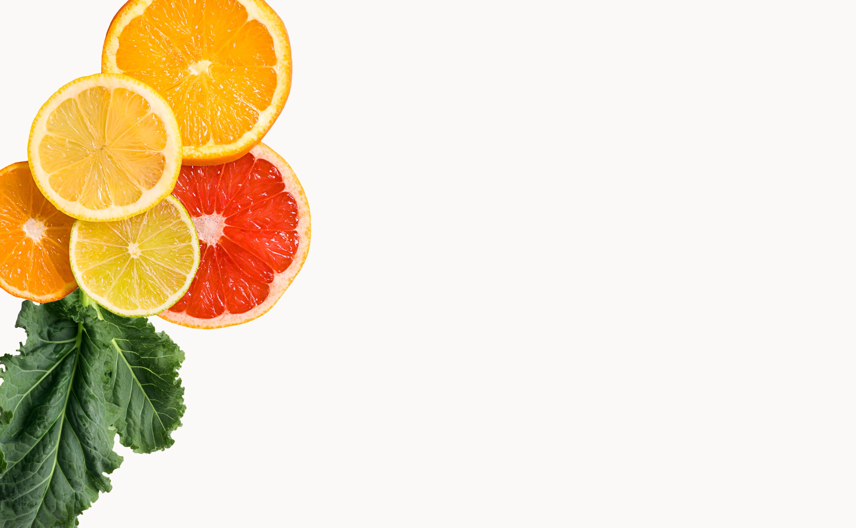 BrainMD Kids' NeuroVite Multivitamin Chewables: slices of citrus fruit against a white background