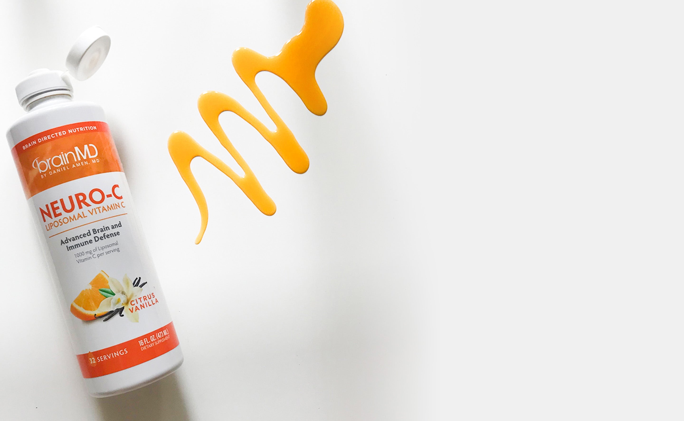 BrainMD Neuro-C Vitamin C: liposomal vitamin C bottle with swash of orange liquid against a white background