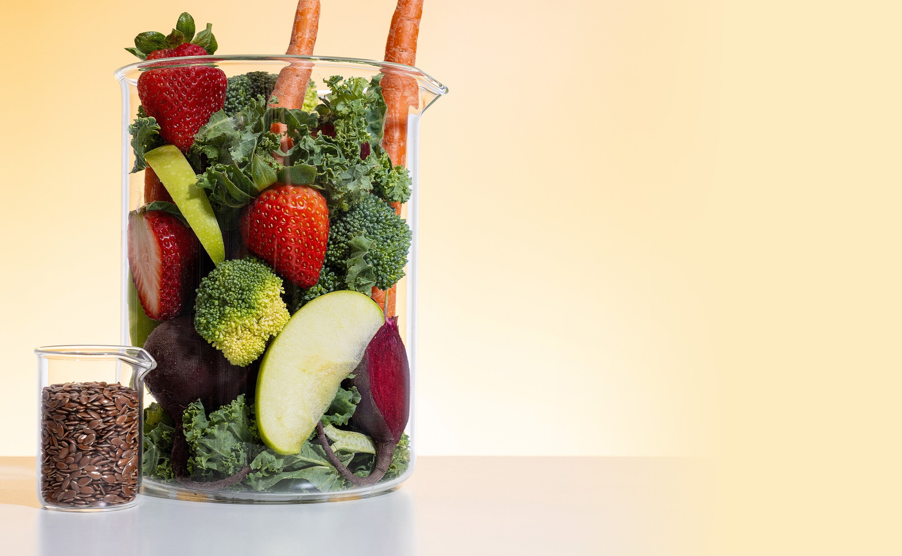 BrainMD Neuro Greens Superfood powder: clear containers filled with fruits, vegetables & seeds against a yellow background