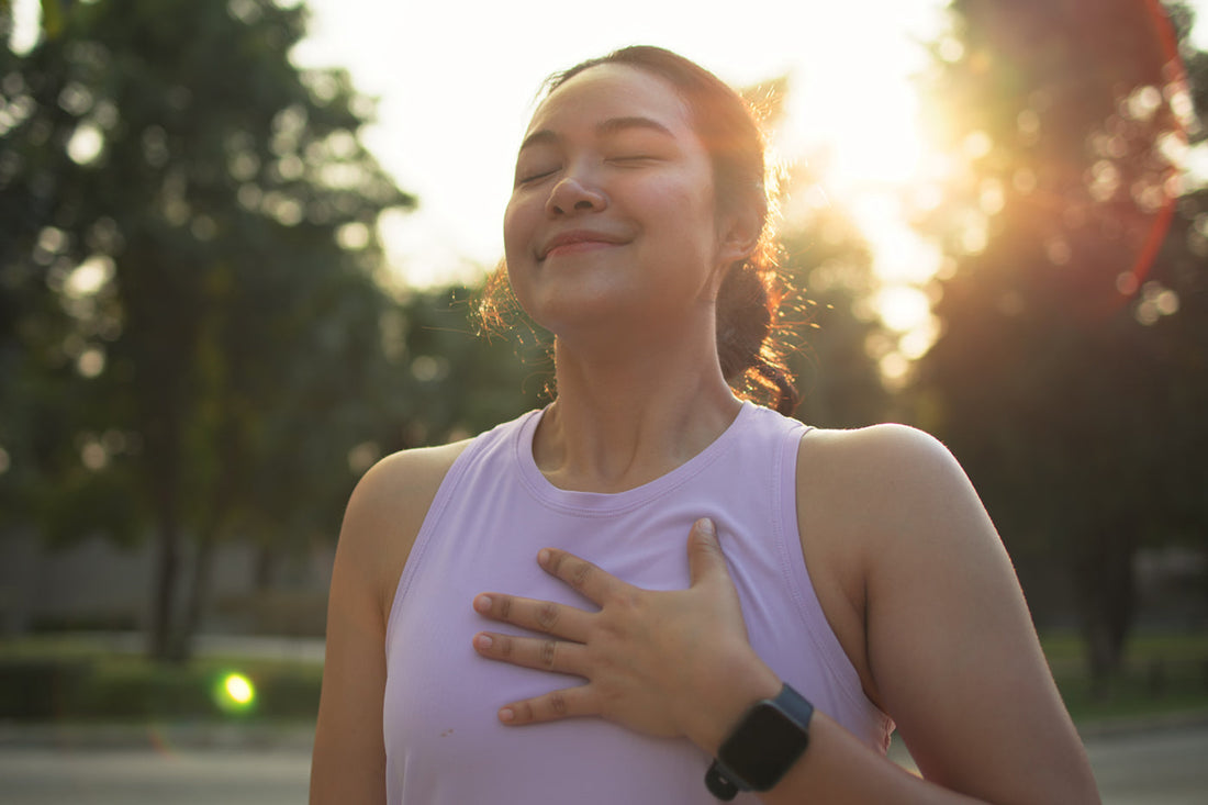 woman with hand on heart focused on Dr. Amen's four circles of health