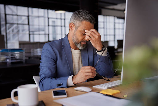 a man at work deciding if he's burned out or just tired