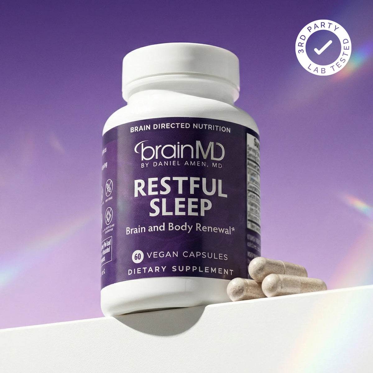 BrainMD Restful Sleep supplement bottle and capsules with third-party lab tested badge, independently tested by Intertek