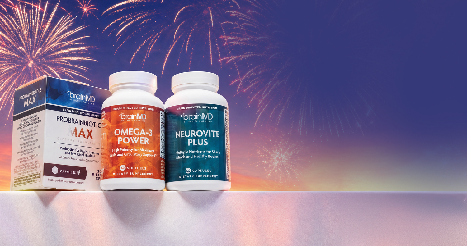 Three supplement bottles with colorful fireworks in the background