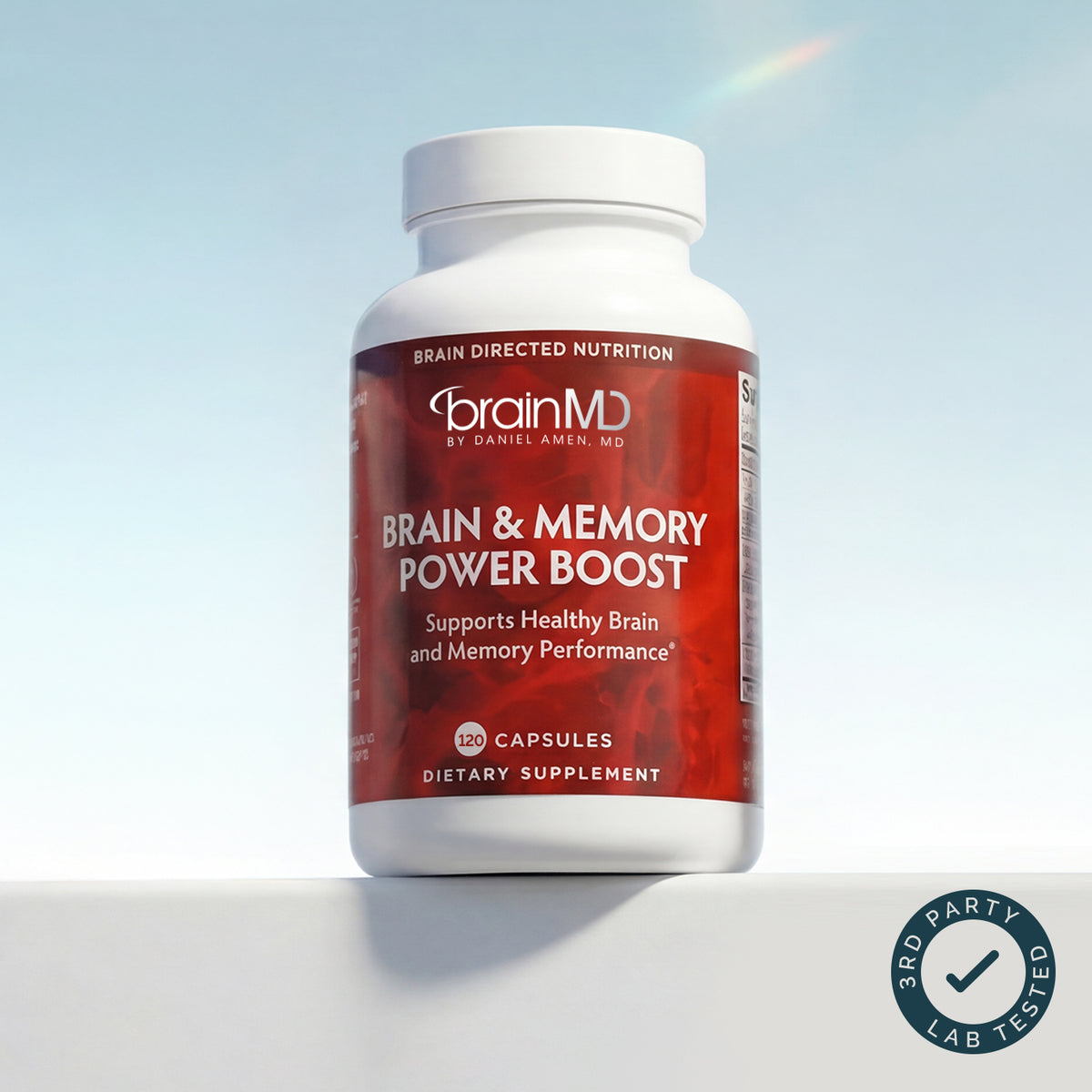 BrainMD Brain & Memory Power Boost red bottle of capsules on a pale blue background with a third-party tested badge