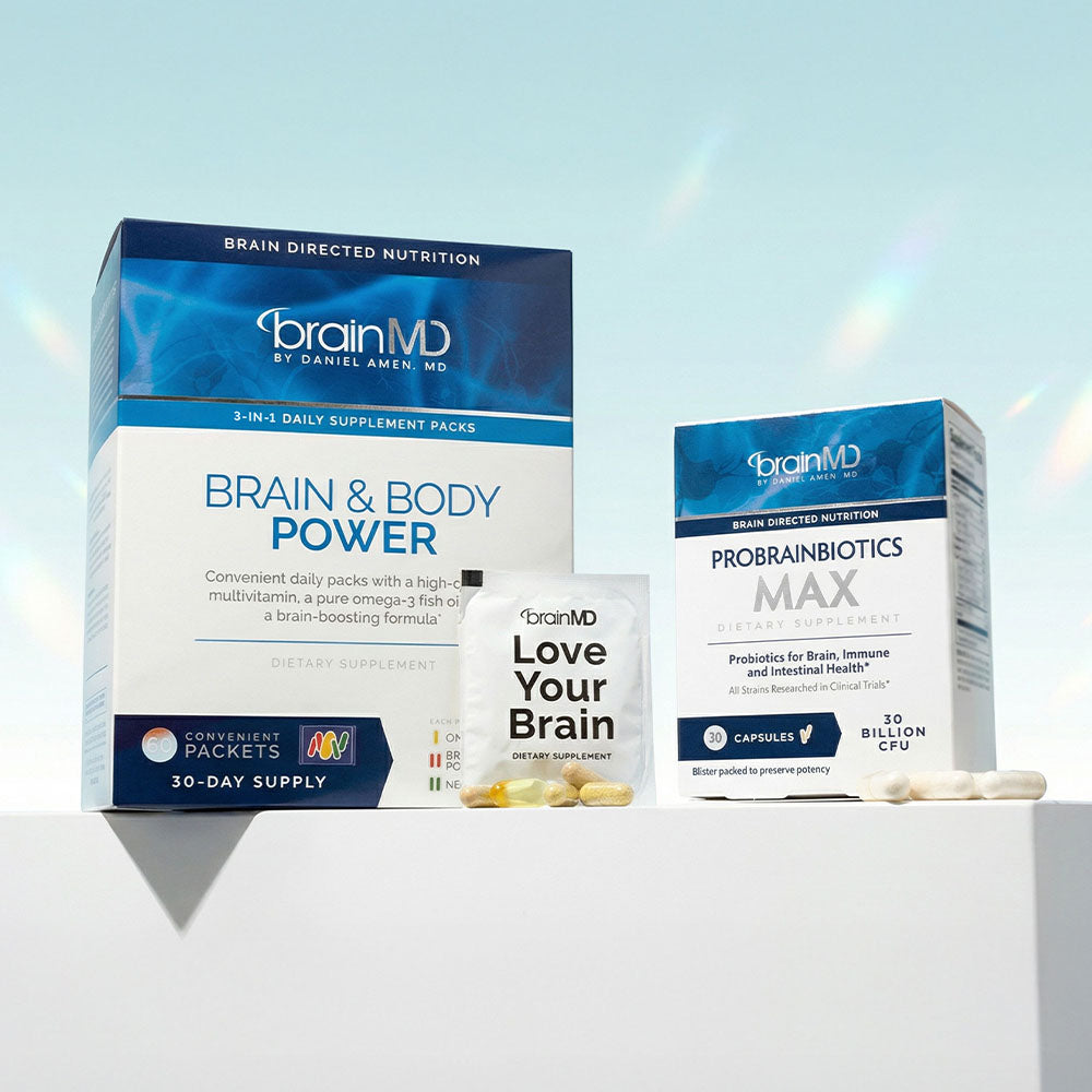 BrainMD's Brain & Body Power and ProBrainBiotics MAX supplement packaging on a light blue background.