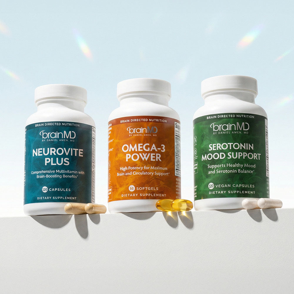 Three supplement bottles against a power blue background.