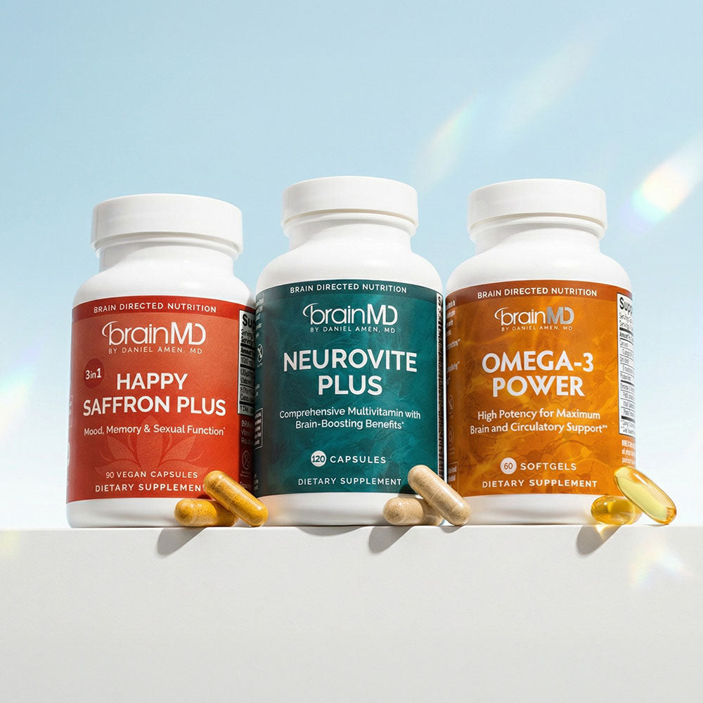 Three supplement bottles against a powder blue background.