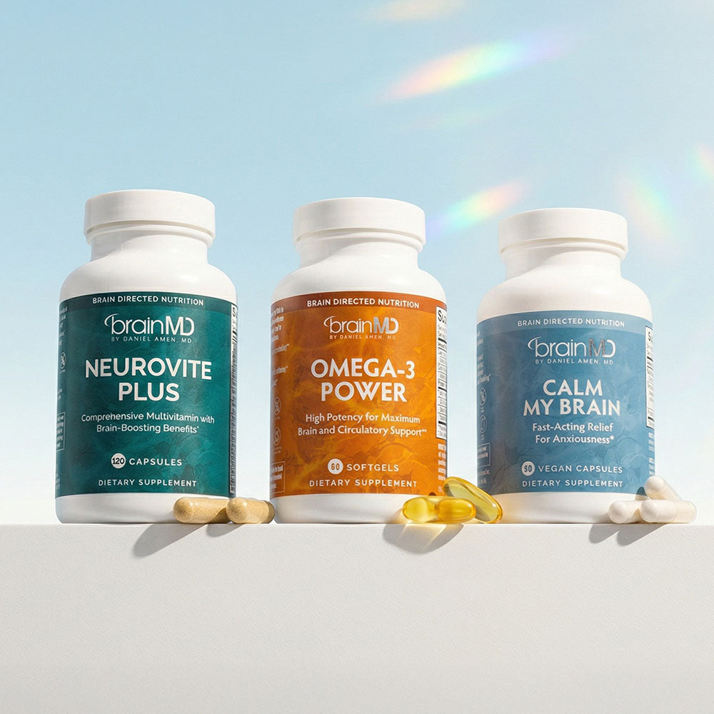 Three supplement bottles against a powder blue background.