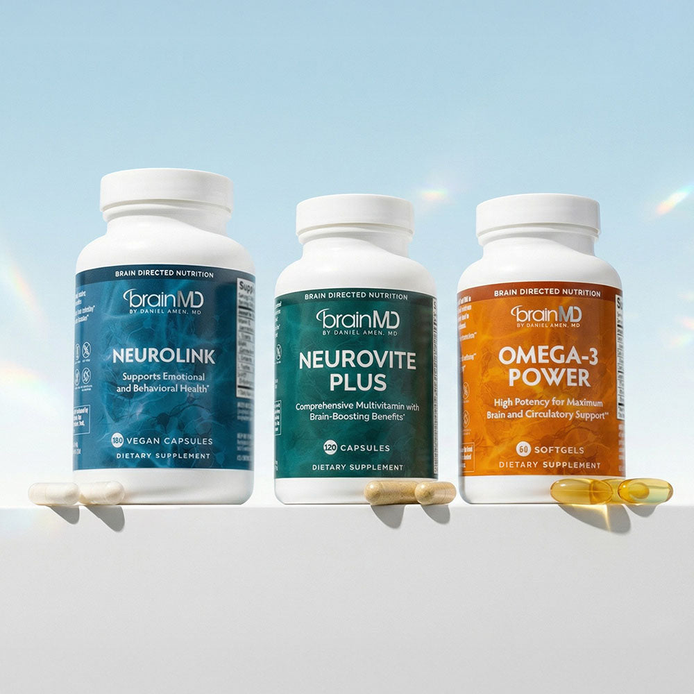 Three supplement bottles against a powder blue background.