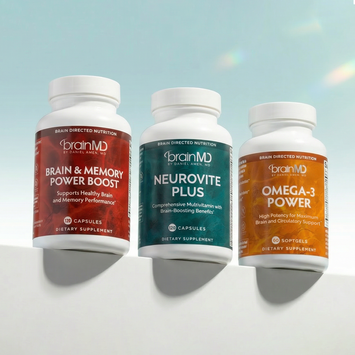 Three supplement bottles against a powder blue background.