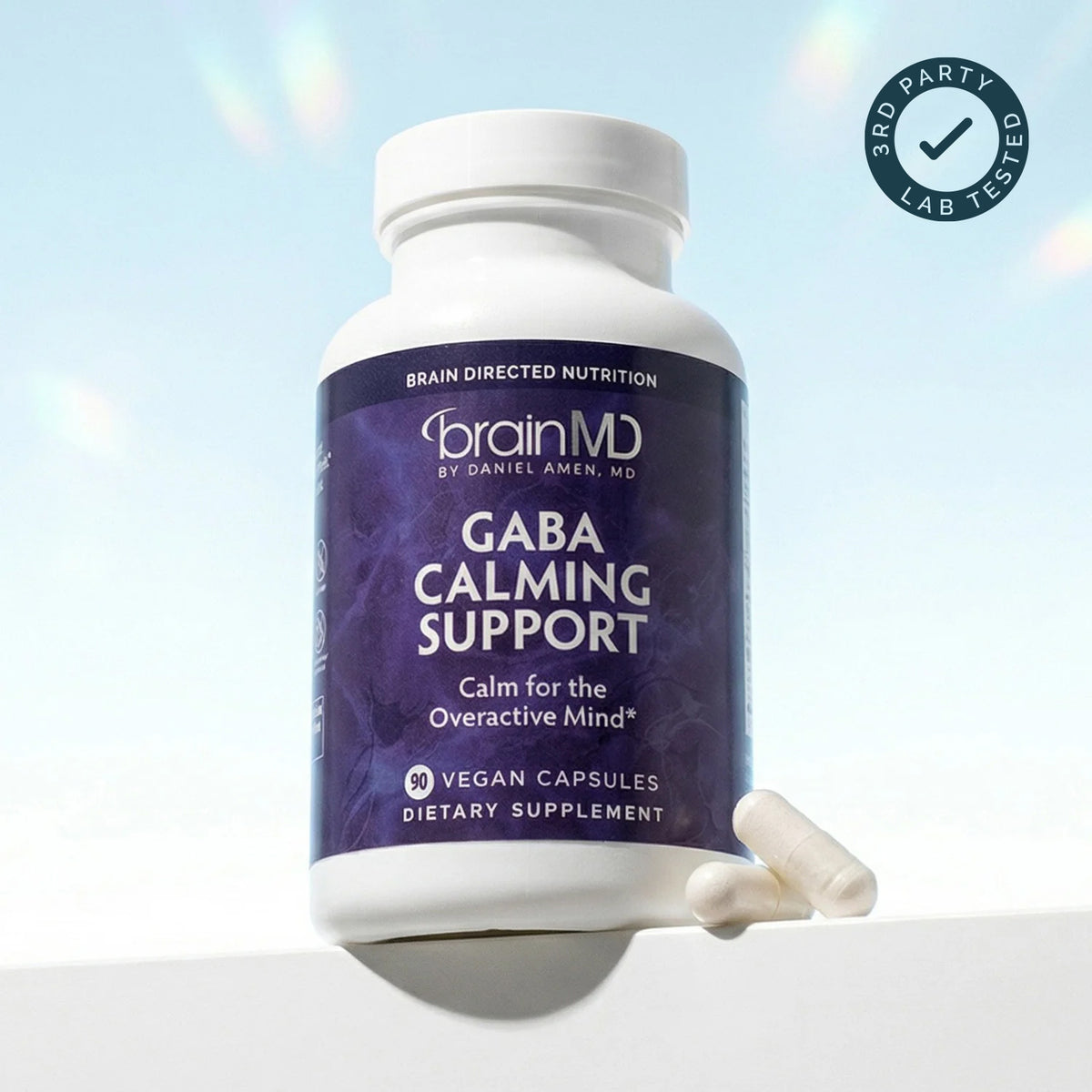 BrainMD GABA Calming Support supplement bottle and capsules with third-party lab tested badge, independently tested by Intertek