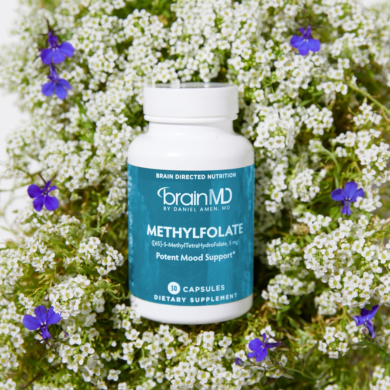 BrainMD Methylfolate: supplement bottle resting on top of a floral arrangement