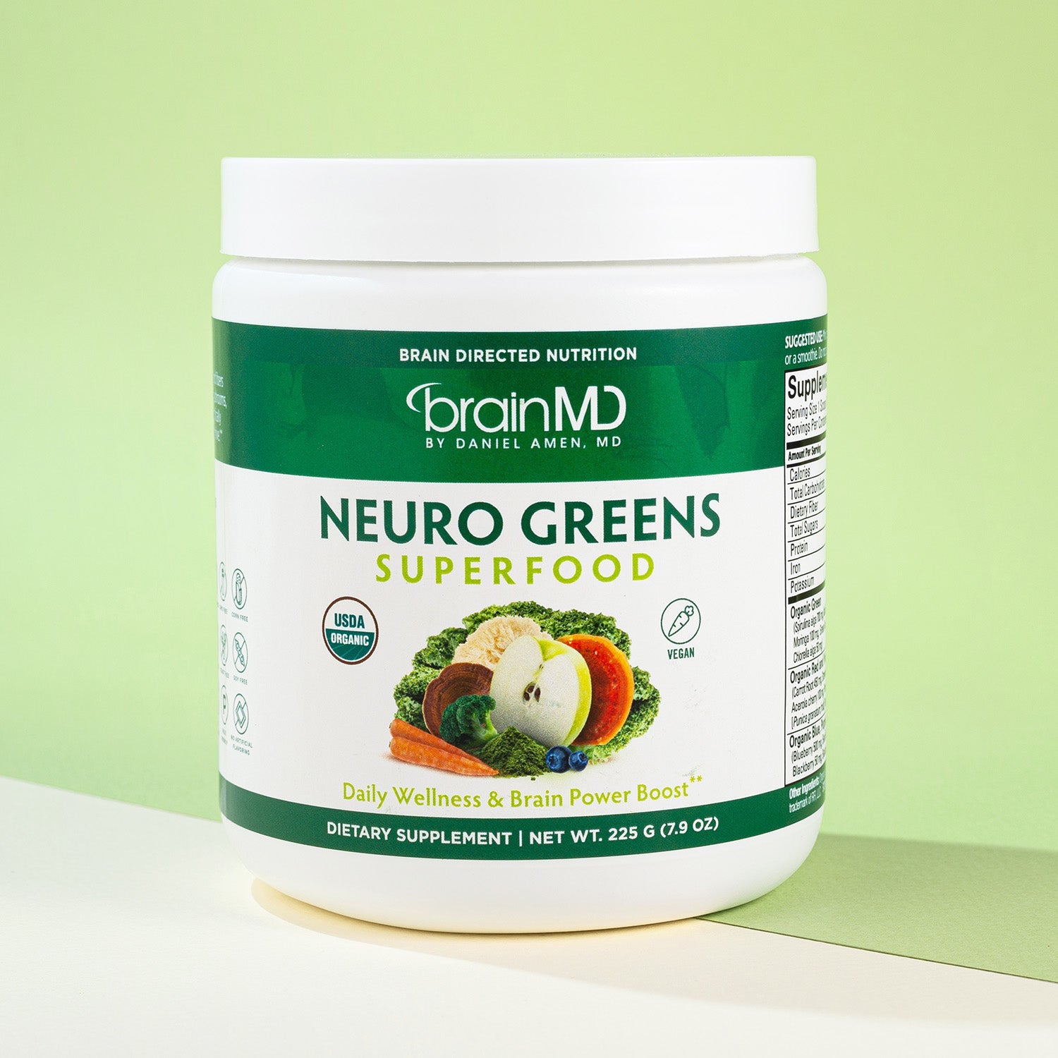 BrainMD Neuro Greens Superfood powder: supplement container against a light green background