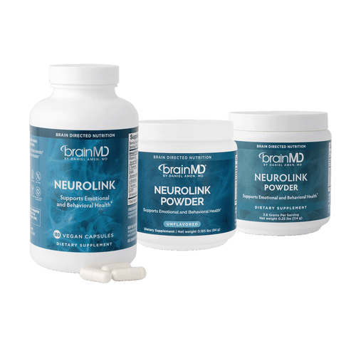 One supplement bottle and two tubs of supplement powder against a transparent background.