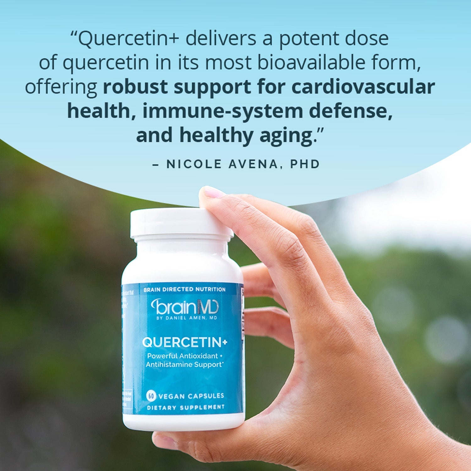 BrainMD Quercetin+: infographic, expert quote above blue supplement bottle against blurred trees exterior background