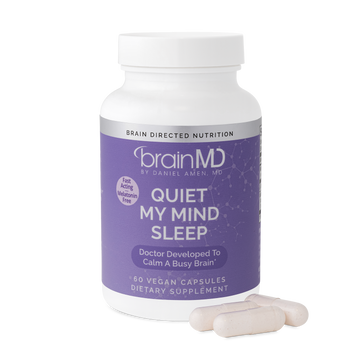 BrainMD Quiet My Mind Sleep: image of bottle and three capsules at its base with transparent background