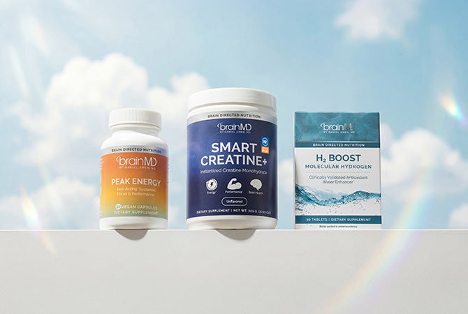 Three supplement containers from branMD on a light blue background with rainbow effects
