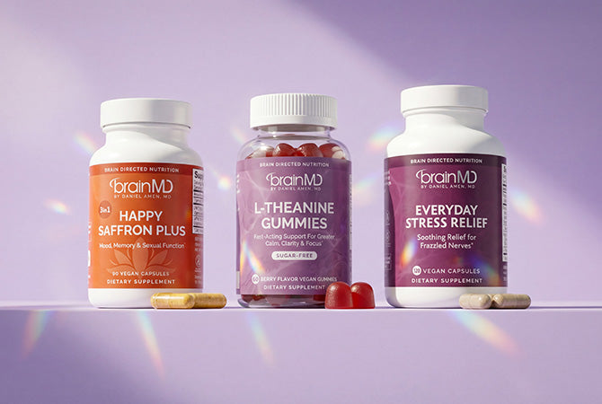 Three supplement bottles against a light purple background.