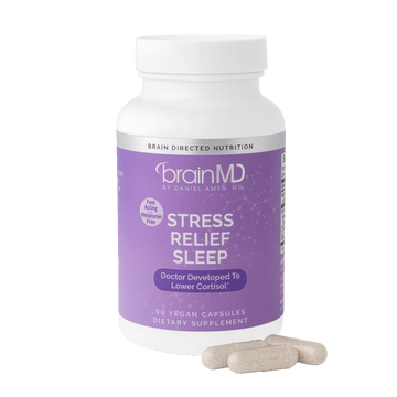 Lavendar supplement bottle with white capsules at the base against a transparent background.