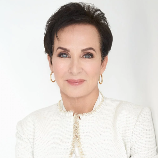 Terry Weber wearing gold hoop earrings against a white background