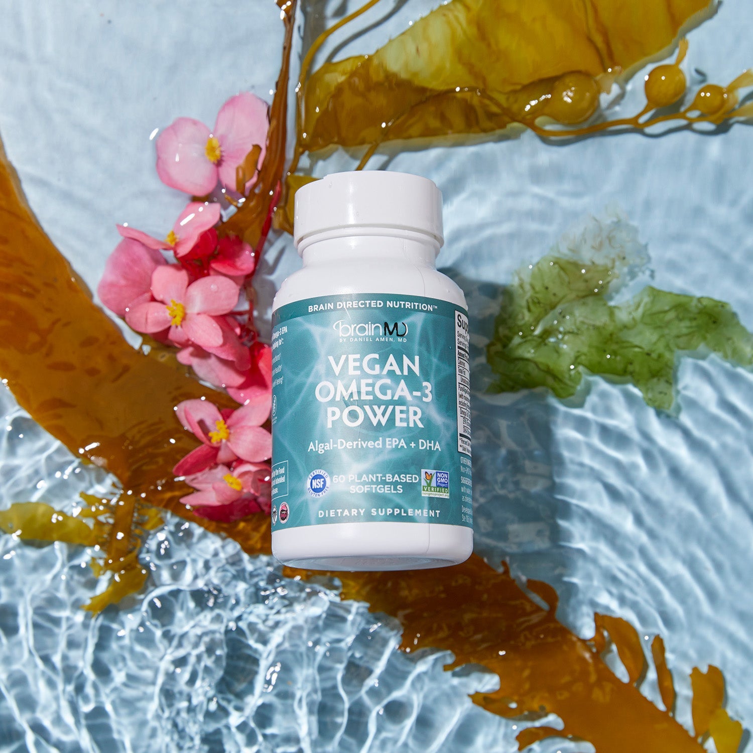 BrainMD Vegan Omega-3 Power:  green supplement bottle with water, algae, and flowers in the background