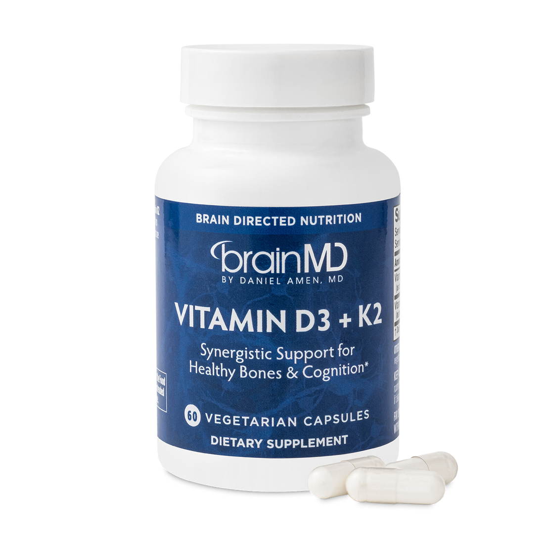 BrainMD Vitamin D3 + K2: image of blue supplement bottle and three off-white capsules at its base with transparent background