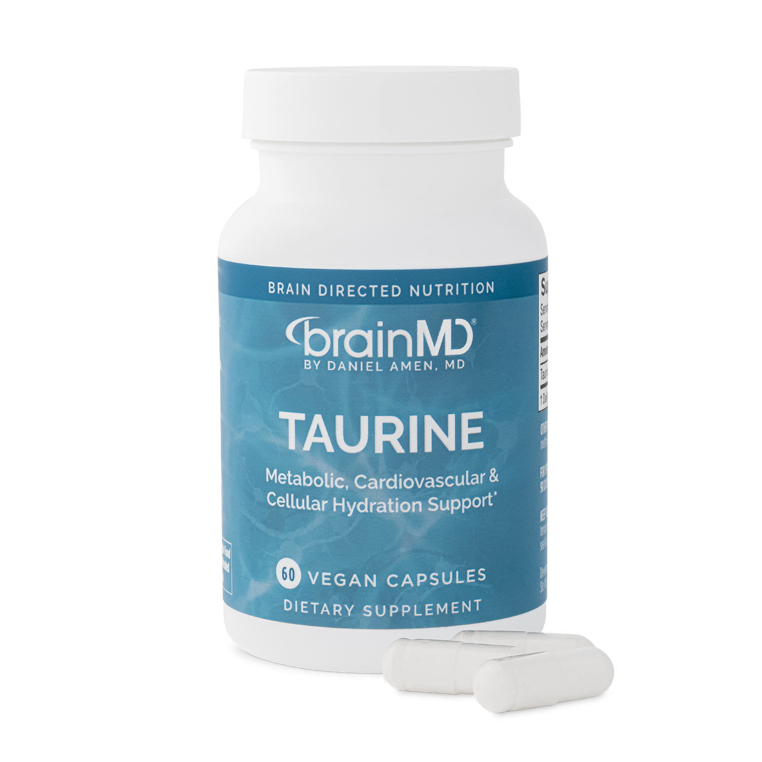 Supplement bottle labeled 'Taurine' by BrainMD with capsules laying in front of it.