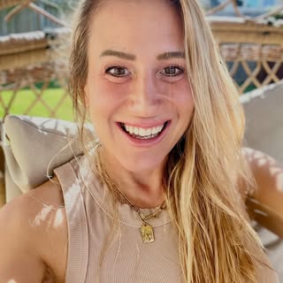 Mercedes Maidana with a tan sitting outdoors on a sunny day