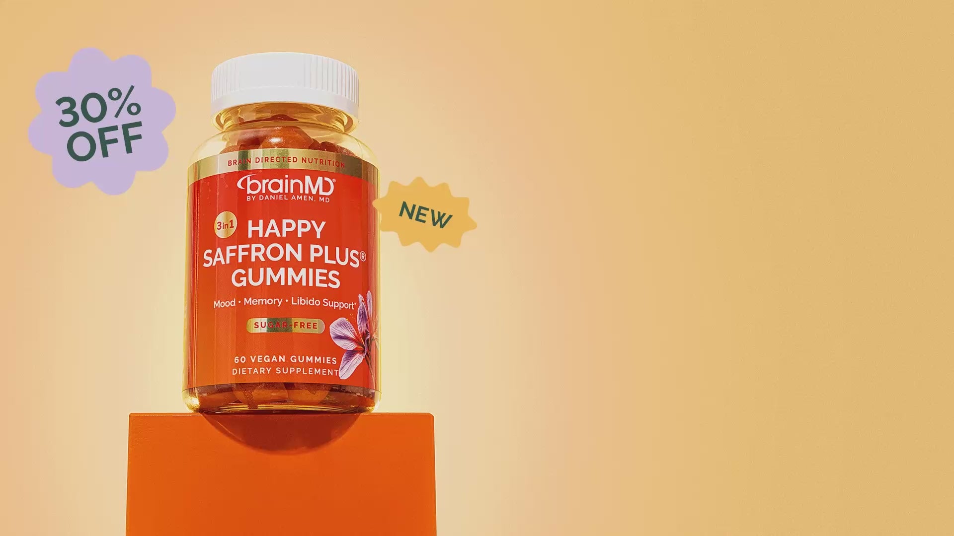 Load video: Bottle of BrainMD's newest product, Happy Saffron Plus Gummies, on an orange box with 30% off and falling gummies for fun, dramatic effect.