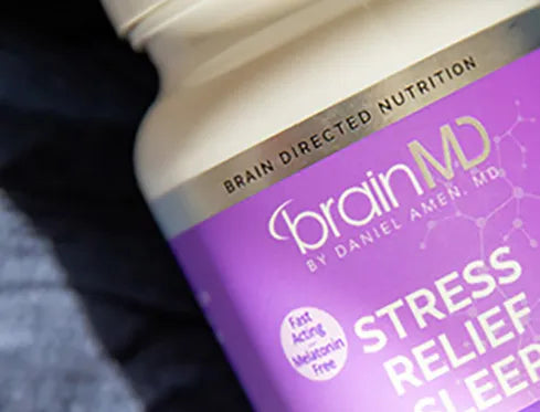 Close-up of purple supplement bottle.